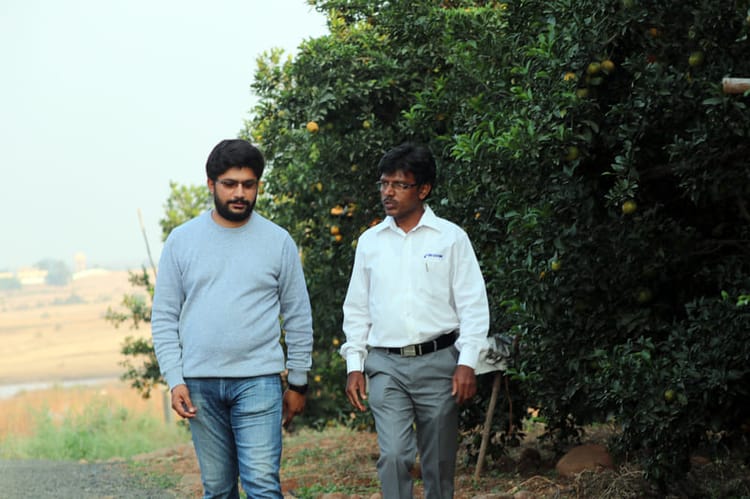 Netafim employee discussing with the farmer